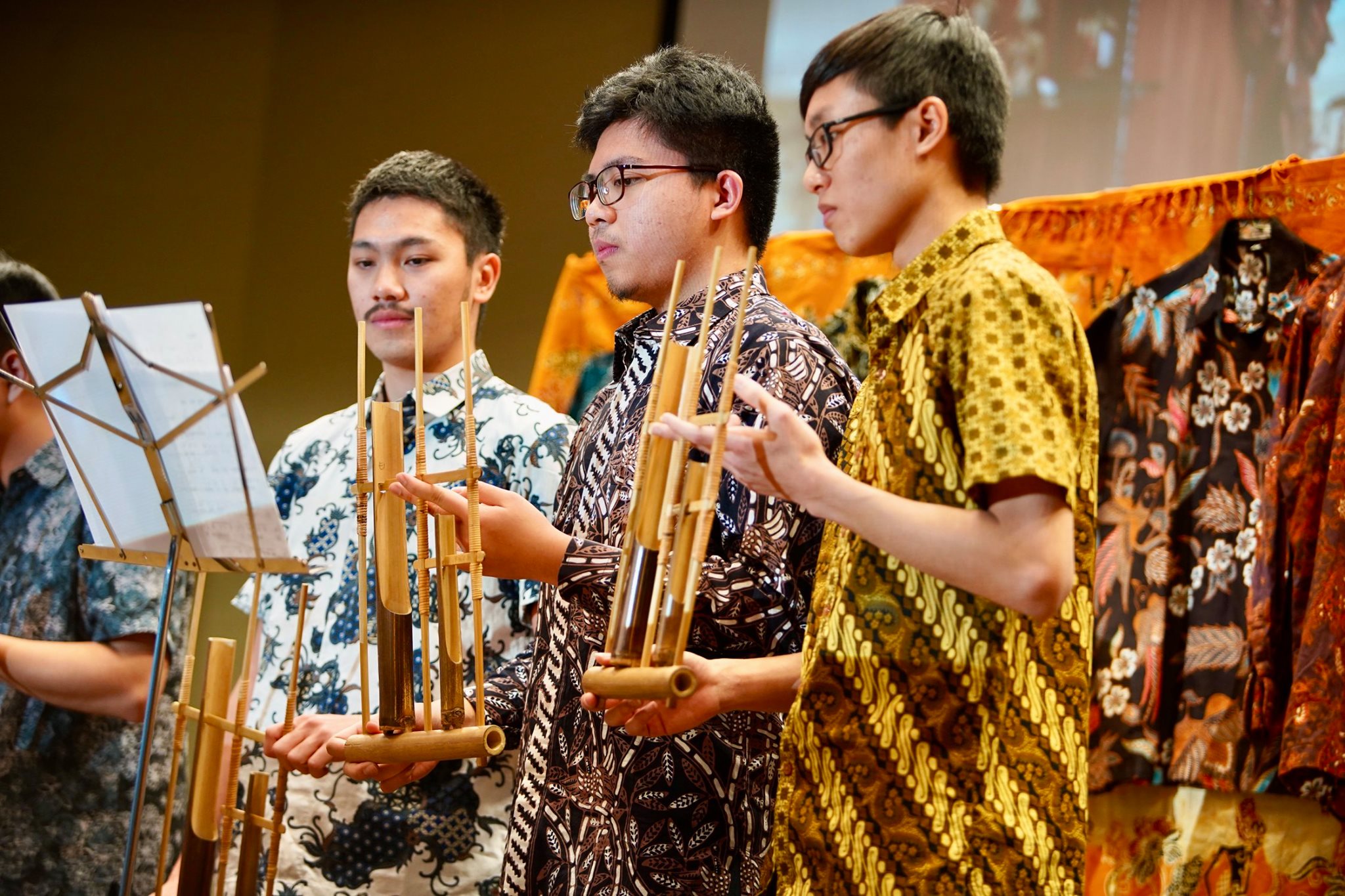 students playing traditional wood instruments